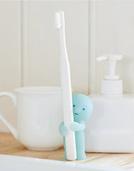 Smiski® Toothbrush Stand: Holding