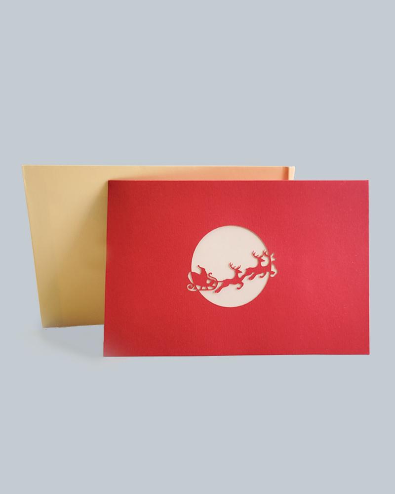 Santa's Sleighride 3D Pop-Up Card against gold envelope