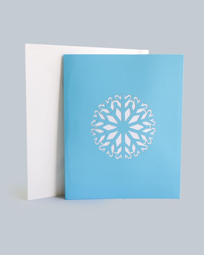 Snowflake 3D Pop-Up Card against white envelope